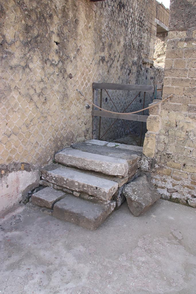 II.1 Herculaneum, October 2023.
Steps and doorway in south-east corner of atrium. Photo courtesy of Klaus Heese.